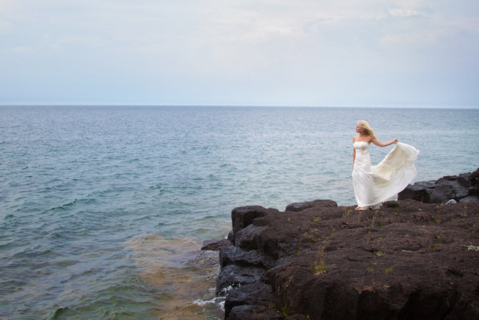 Bride on rocky shoreline of beautiful Lake Superior