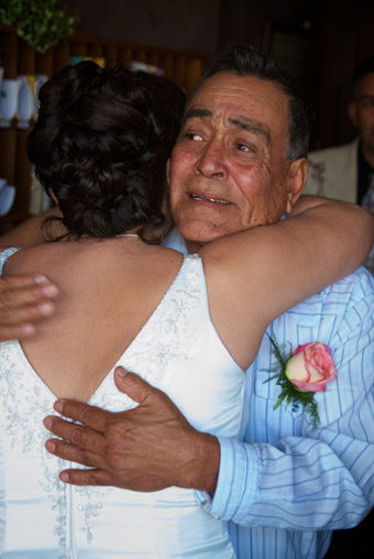 Father embracing bride before ceremony
